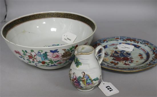 A Chinese Export polychrome sparrowbeak cream jug in the European taste, a punch bowl and a plate (damage and repairs)